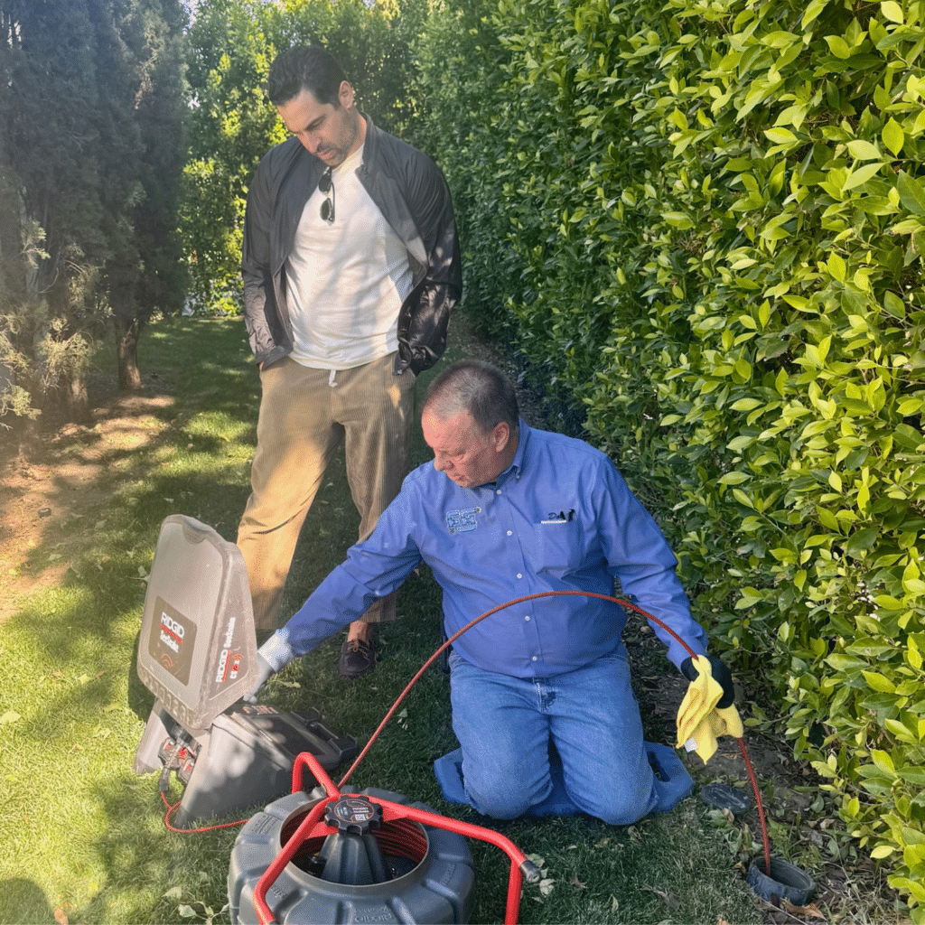 Father & Son Hydro-Jetting technician performing drain camera inspection